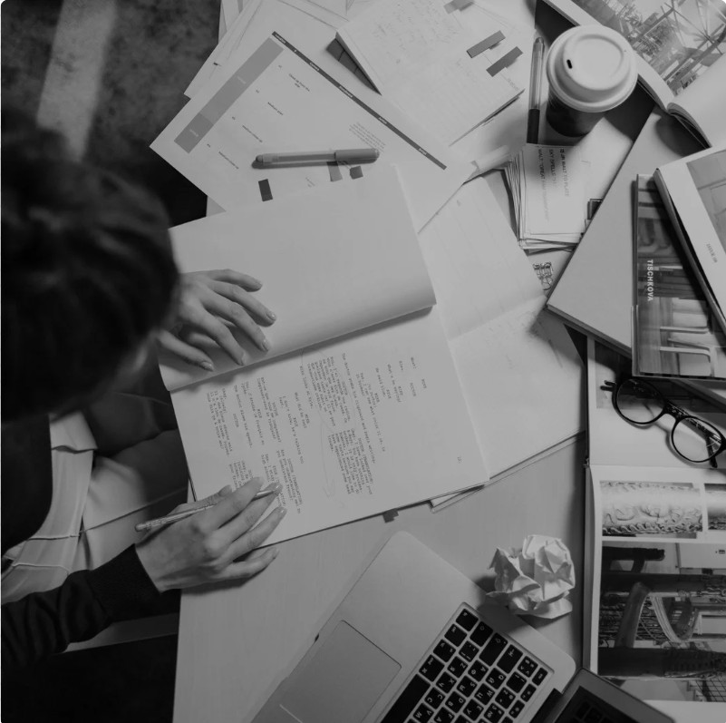 Reading and annotating a printed document among layered papers and a laptop